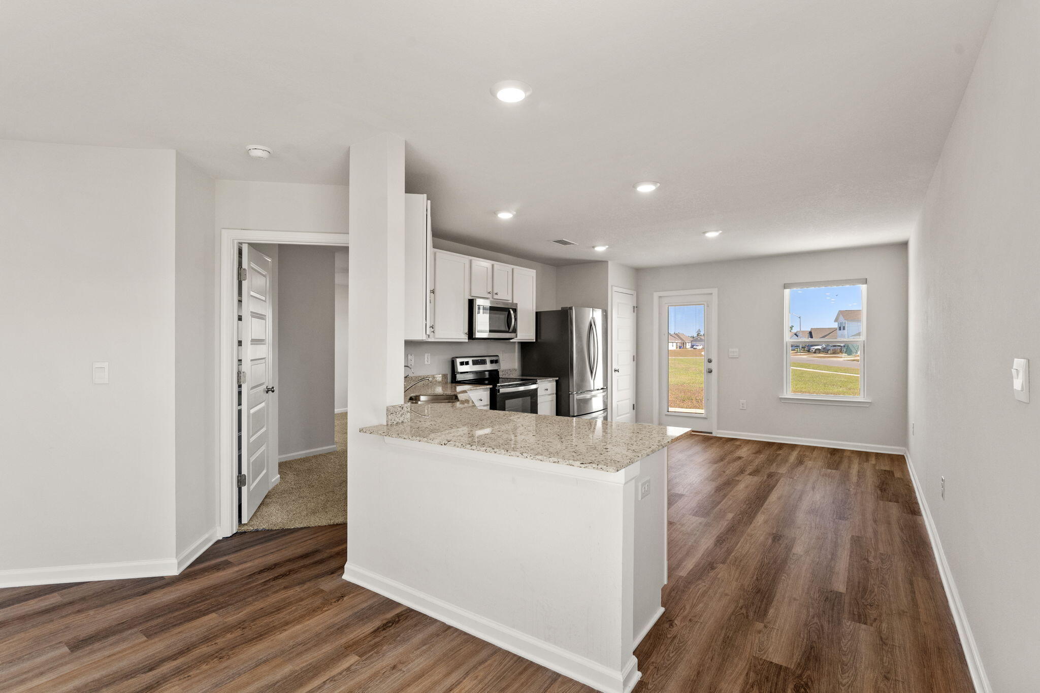 6570 Atkins Road Panama City, FL 32404 - Photo 9 of 50 a view of living room with furniture and wooden floor