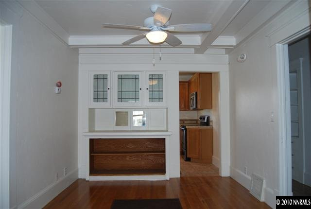 432 Ridge Street Reno, NV 89501 - Photo 3 of 7 a view of hallway with wooden floor and a fireplace