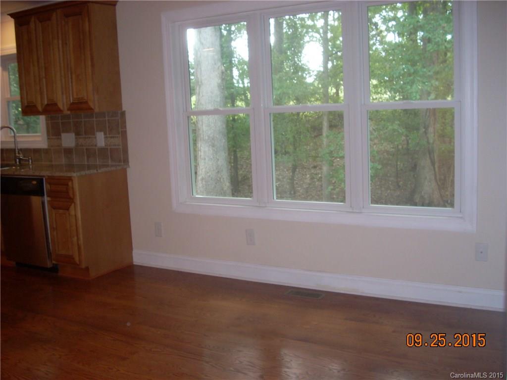 9424 Fairway Ridge Road Charlotte, NC 28277 - Photo 8 of 19 a view of an empty room with a window