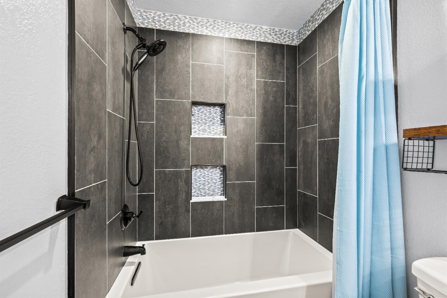 4818 Fall Street El Dorado, CA 95623 - Photo 17 of 31 a bathroom with a tub and shower