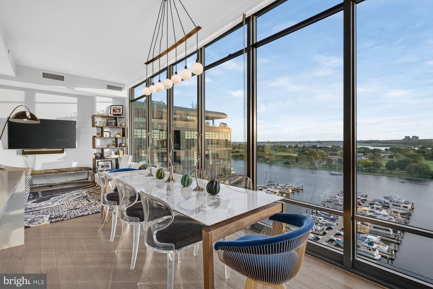 45 Sutton Square Southwest, Unit PH01 Washington, DC 20024 - Photo 26 of 87 Dining w/floor-to-ceiling windows & views