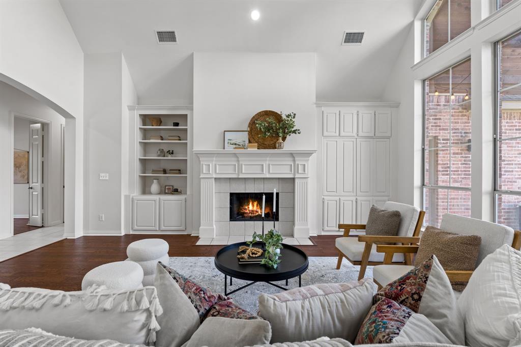 4821 Ravendale Drive Richardson, TX 75082 - Photo 11 of 40 a living room with furniture and a fireplace