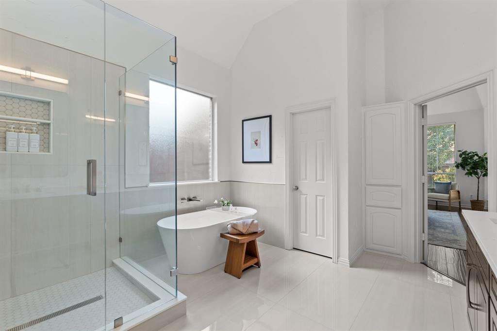 4821 Ravendale Drive Richardson, TX 75082 - Photo 25 of 40 a bathroom with a sink a toilet and shower