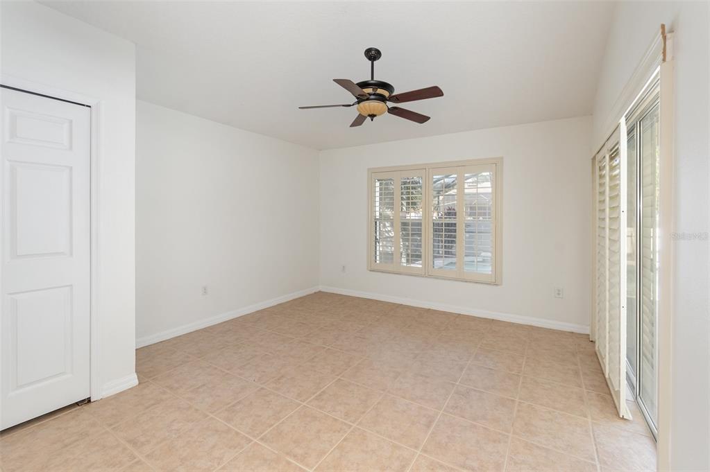 729 Strihal Loop Oakland, FL 34787 - Photo 25 of 33 a view of a livingroom with a ceiling fan and window