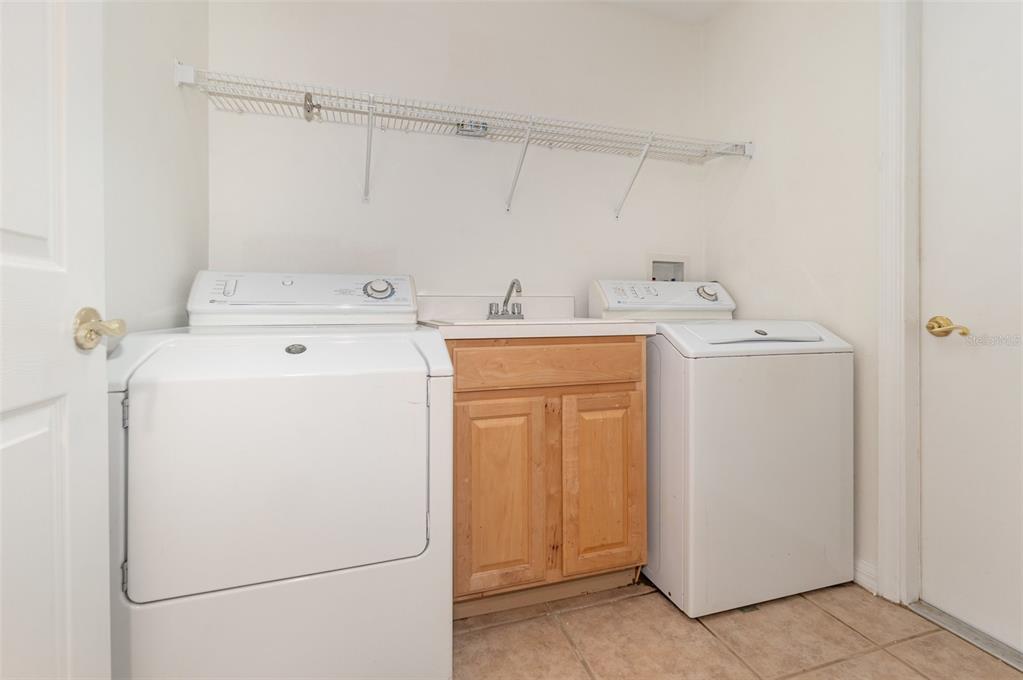 729 Strihal Loop Oakland, FL 34787 - Photo 27 of 33 a utility room with dryer and washer