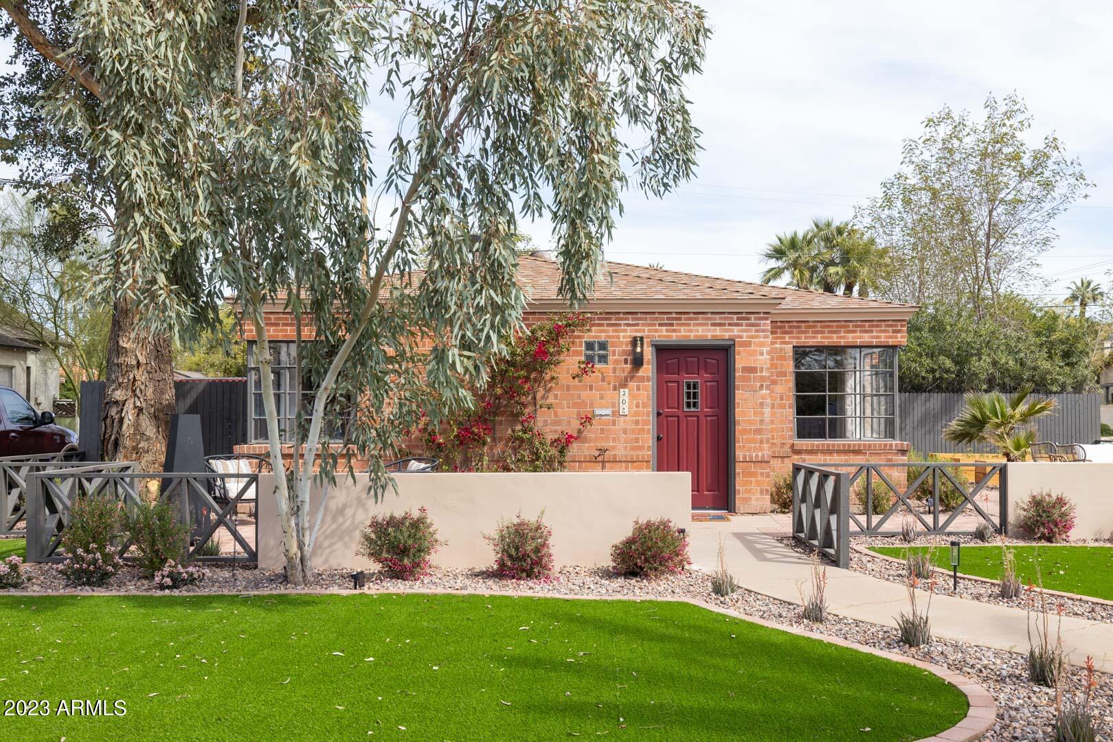 302 West Granada Road Phoenix, AZ 85003 - Photo 1 of 81 a view of a house with backyard sitting area and garden