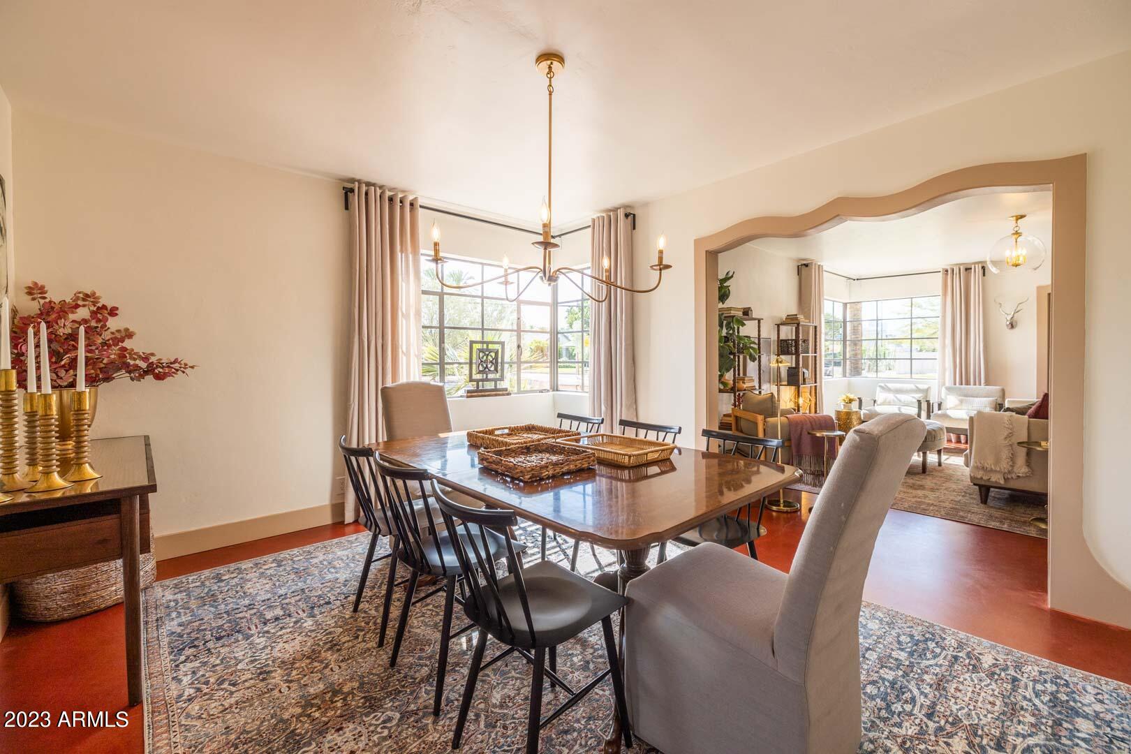 302 West Granada Road Phoenix, AZ 85003 - Photo 20 of 81 a dining room with furniture a rug and a chandelier