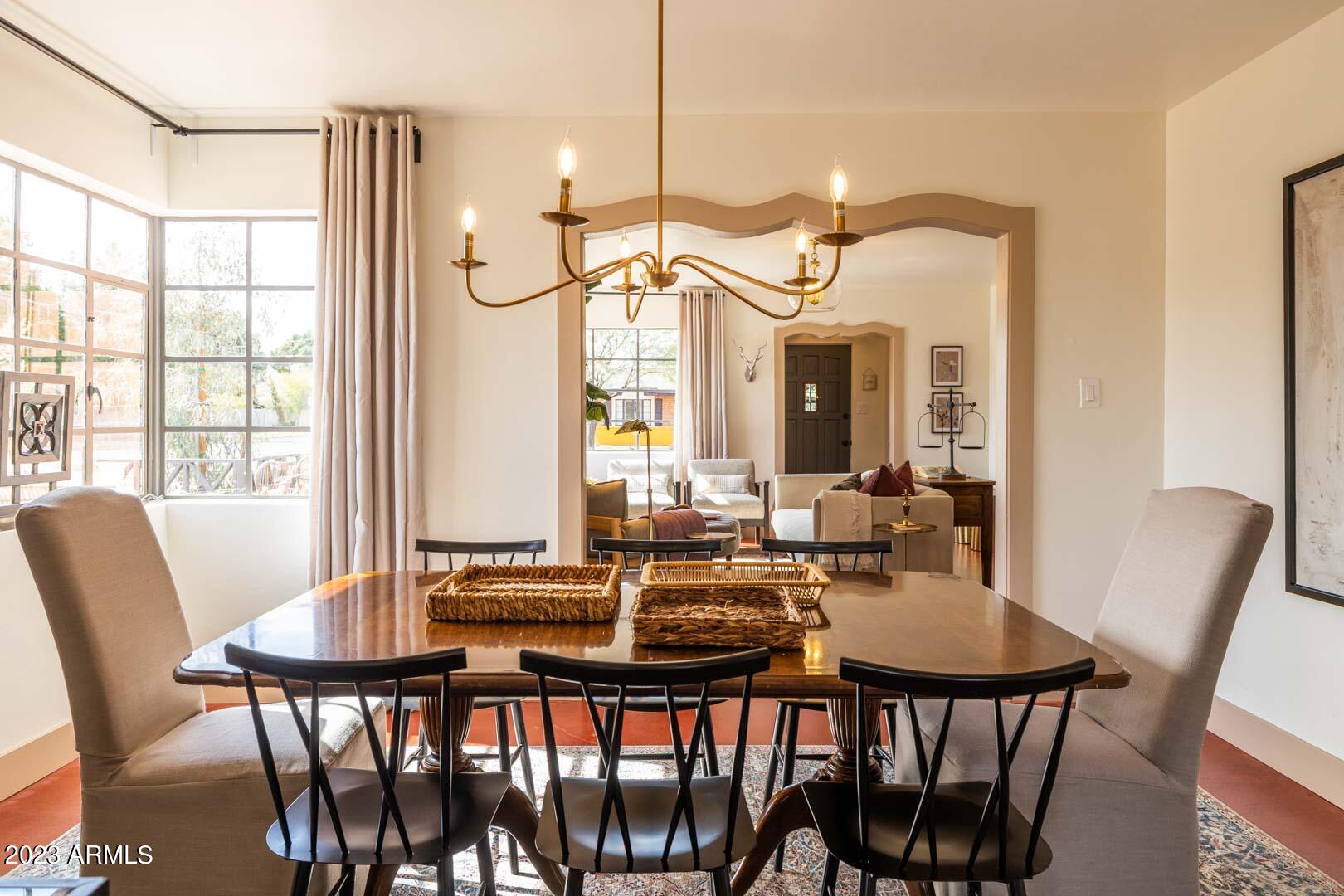 302 West Granada Road Phoenix, AZ 85003 - Photo 22 of 81 a dining room with furniture a chandelier and wooden floor