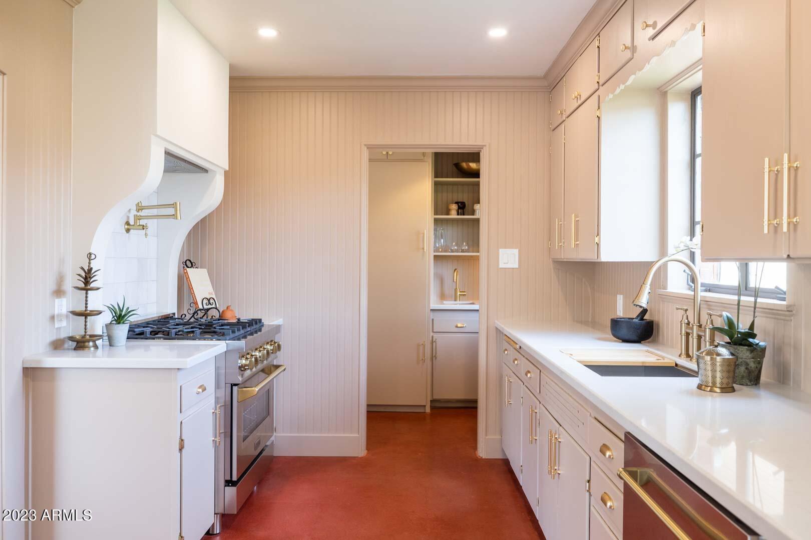 302 West Granada Road Phoenix, AZ 85003 - Photo 28 of 81 a kitchen with a sink dishwasher a stove and a refrigerator