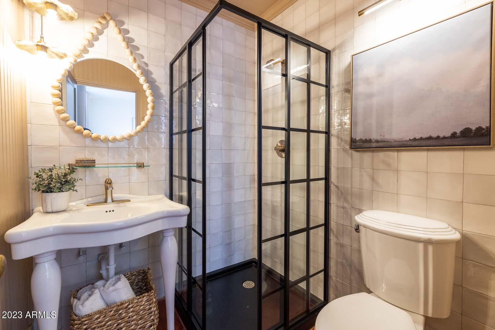 302 West Granada Road Phoenix, AZ 85003 - Photo 53 of 81 a bathroom with a sink toilet and mirror