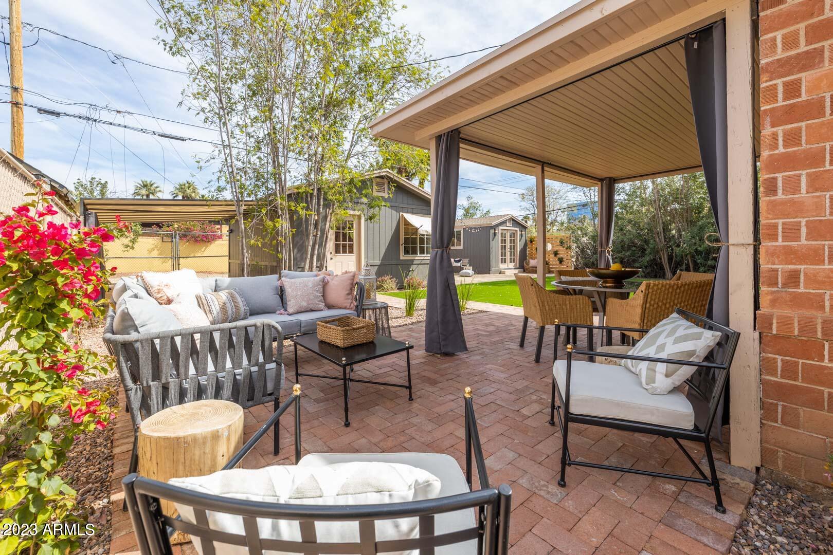 302 West Granada Road Phoenix, AZ 85003 - Photo 61 of 81 a view of a patio with a dining table and chairs