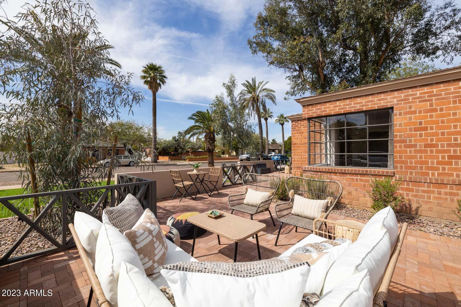 302 West Granada Road Phoenix, AZ 85003 - Photo 7 of 81 a view of a patio with couches table and chairs and potted plants