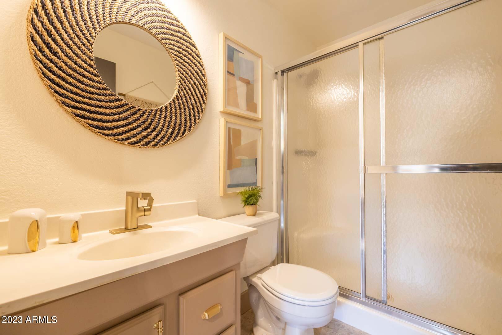 302 West Granada Road Phoenix, AZ 85003 - Photo 72 of 81 a bathroom with a sink a toilet and a mirror