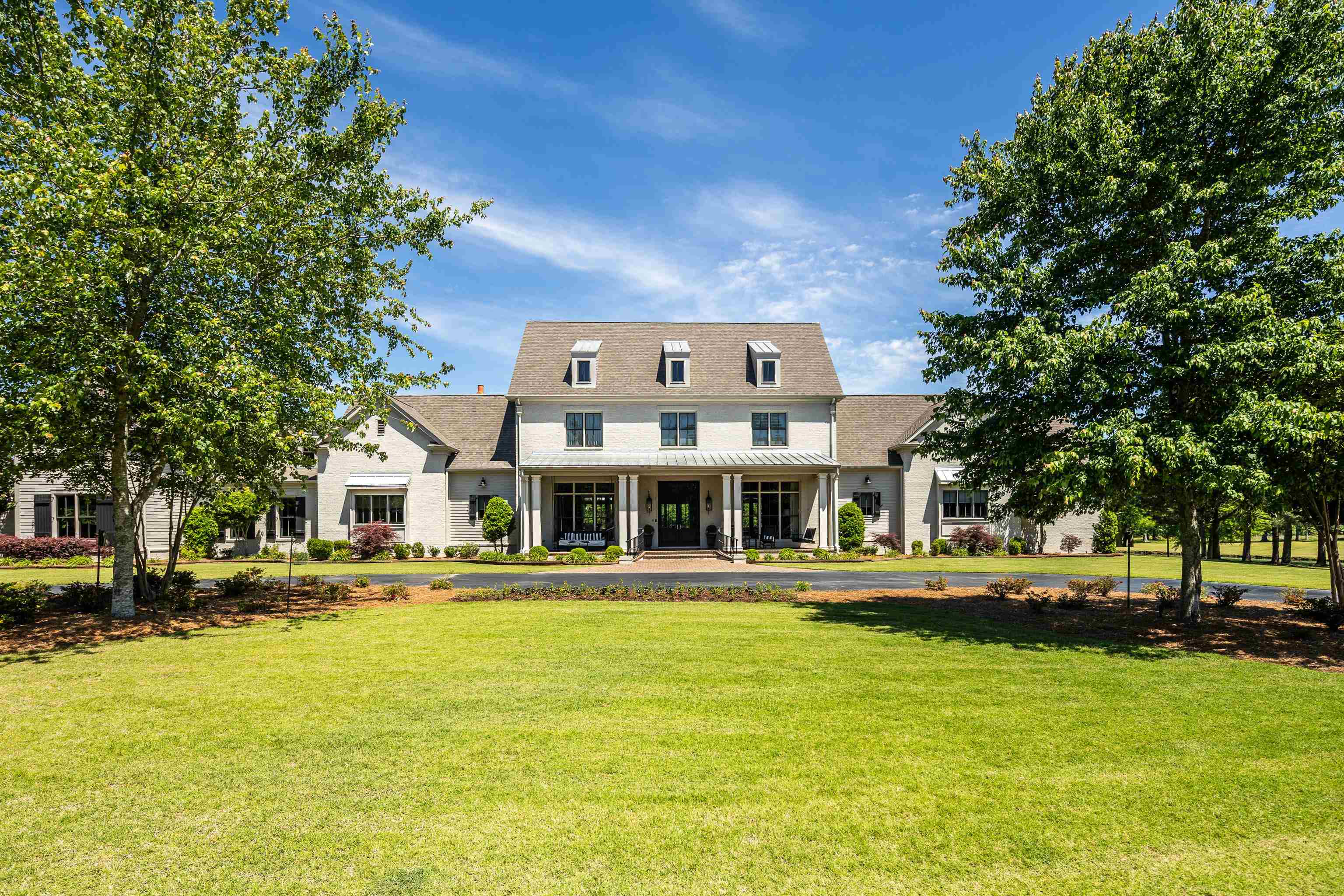 770 Ballard Road Piperton, TN 38017 - Photo 2 of 40 a front view of a building with a garden