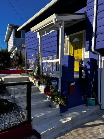 a view of a house with door and deck