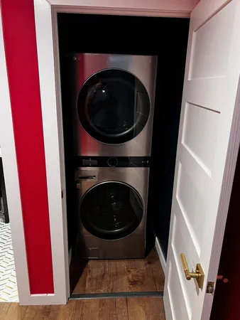 a view of a living room with washer and dryer