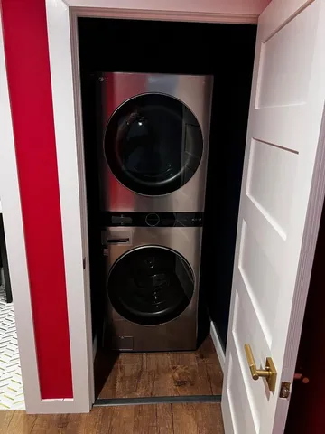 a view of a living room with washer and dryer