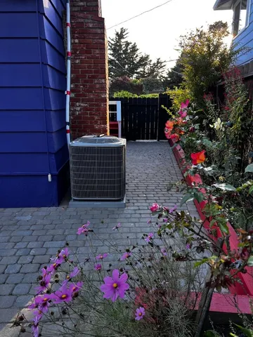 a view of a pathway with a wrought fence