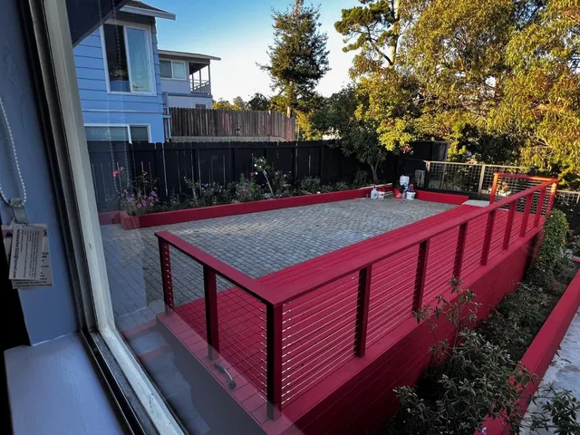 a kitchen with granite countertop stainless steel appliances and wooden cabinets