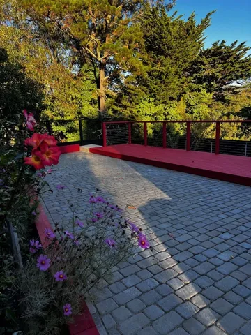 a kitchen with stainless steel appliances kitchen island granite countertop a refrigerator and a stove top oven