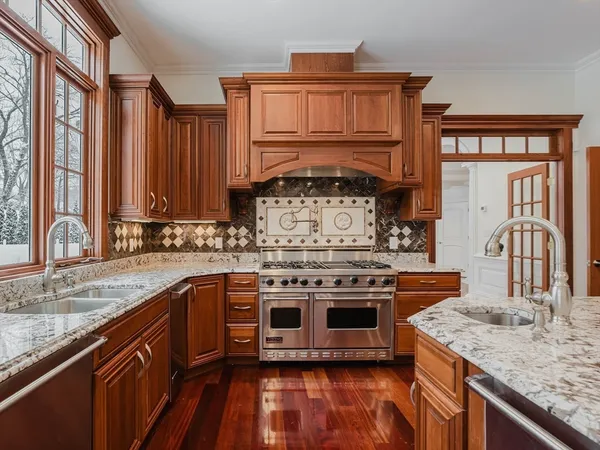 a kitchen with a stove and a sink