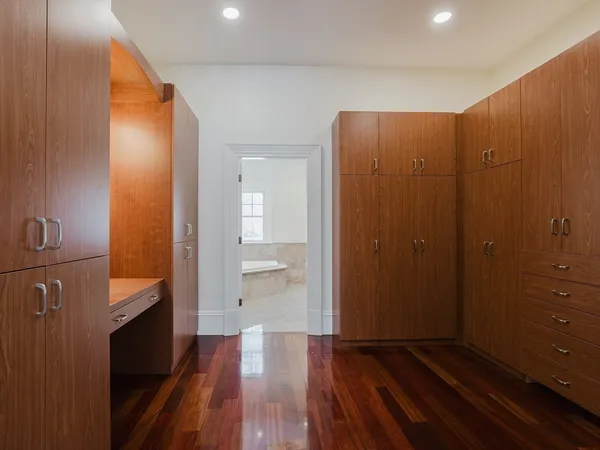 a view of hallway with wooden floor