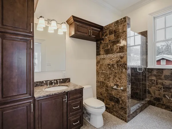 a bathroom with a toilet and shower