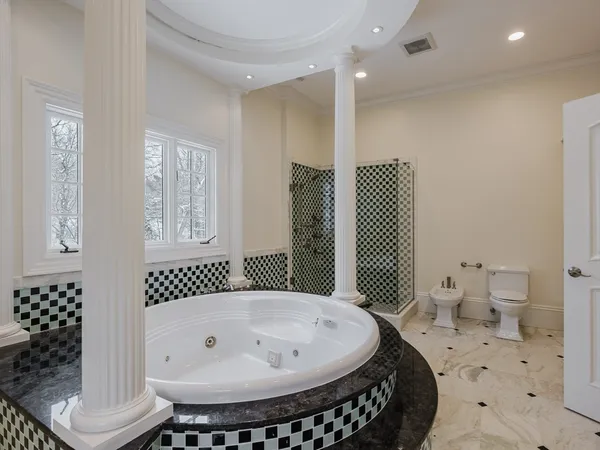 a bathroom with a bathtub and a shower