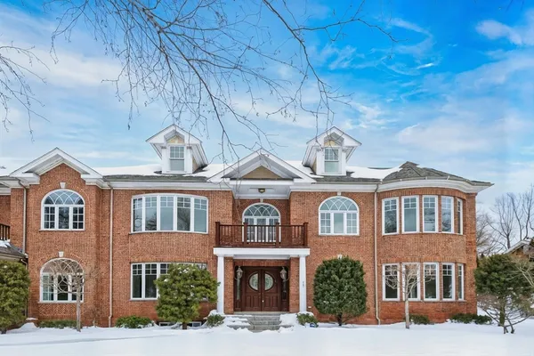 a front view of a residential apartment building with a yard