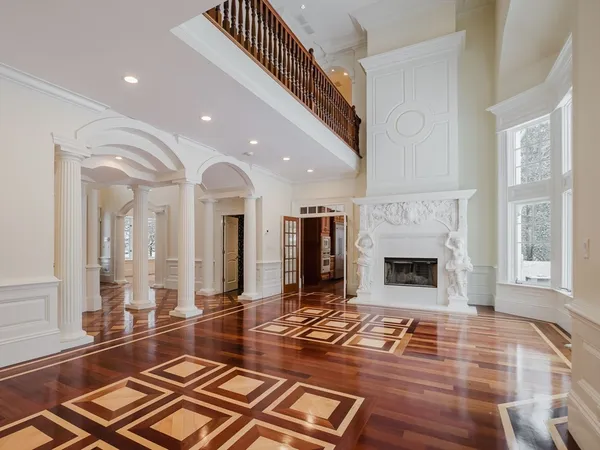 a lobby with furniture and a fireplace