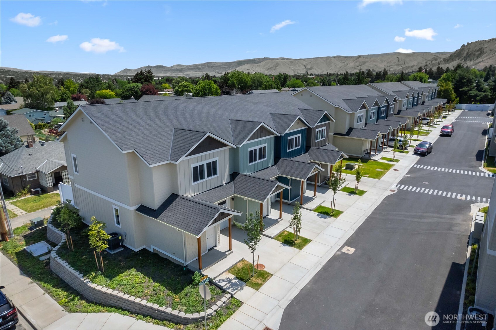1030 Finch Lane, Unit A1 Wenatchee, WA 98801 - Photo 2 of 28 an aerial view of a house with a garden and plants