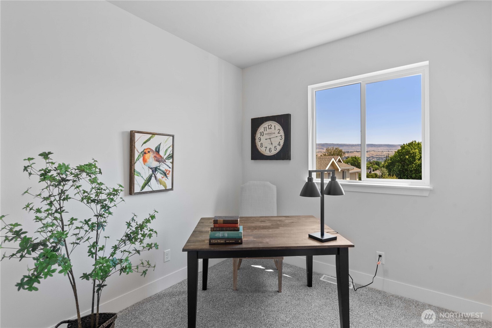 1030 Finch Lane, Unit A1 Wenatchee, WA 98801 - Photo 23 of 28 a view of a workspace with a table and a potted plant
