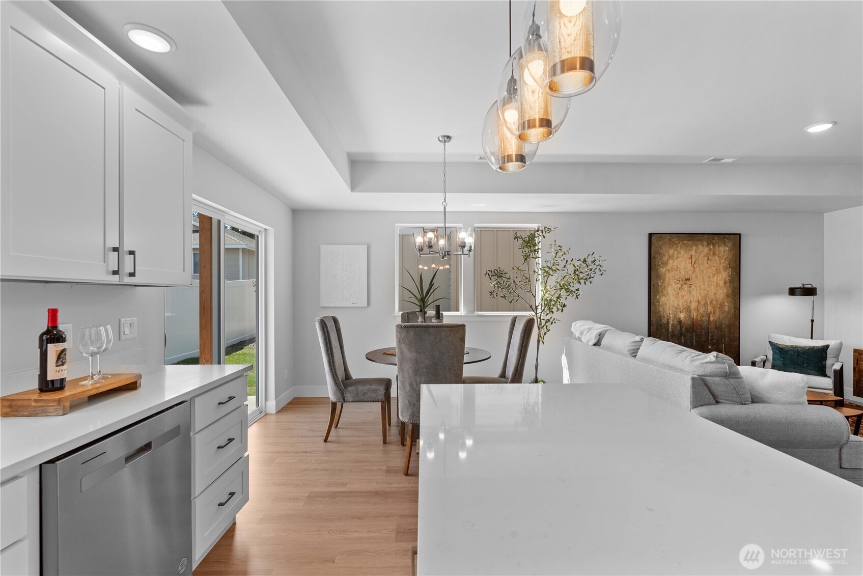 1030 Finch Lane, Unit A1 Wenatchee, WA 98801 - Photo 9 of 28 a living room with furniture a dining table and chairs with wooden floor