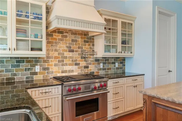 a kitchen with cabinets and appliances