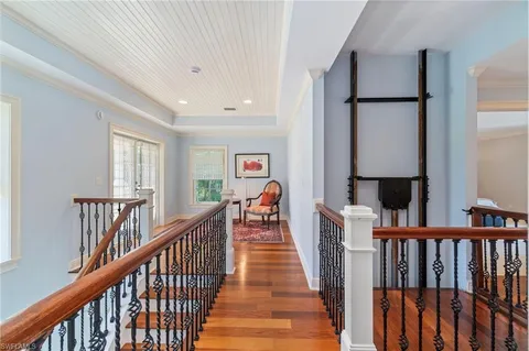 a view of a hallway view with staircase