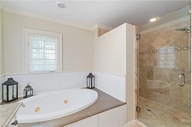 a bathroom with a tub and a shower