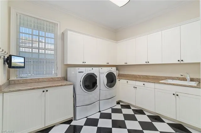 a kitchen with a stove a sink and a microwave