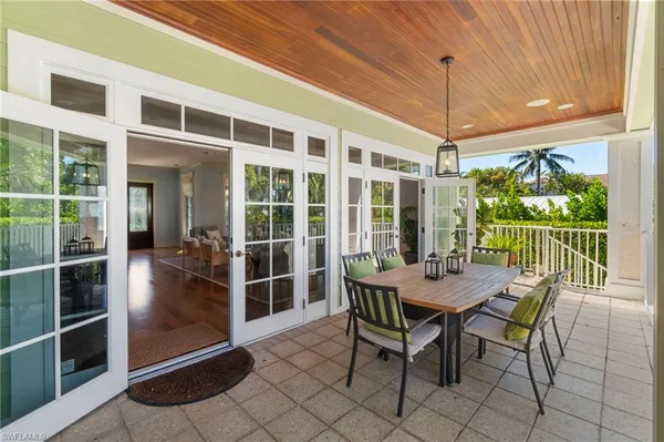 a table and chairs in front of a house