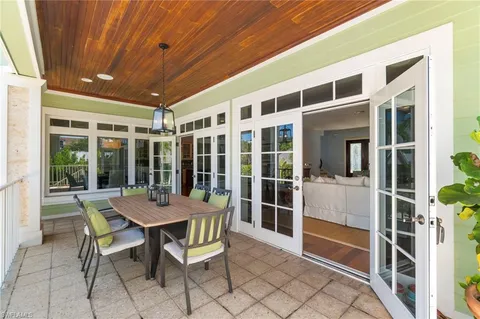 a view of a patio with a table and chairs