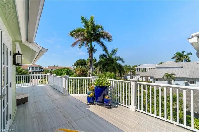 a view of a balcony with wooden floor