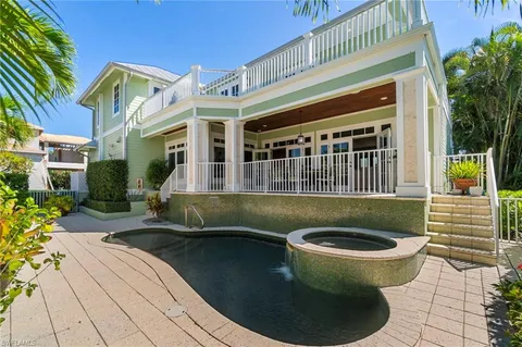 a view of a house with sitting pool