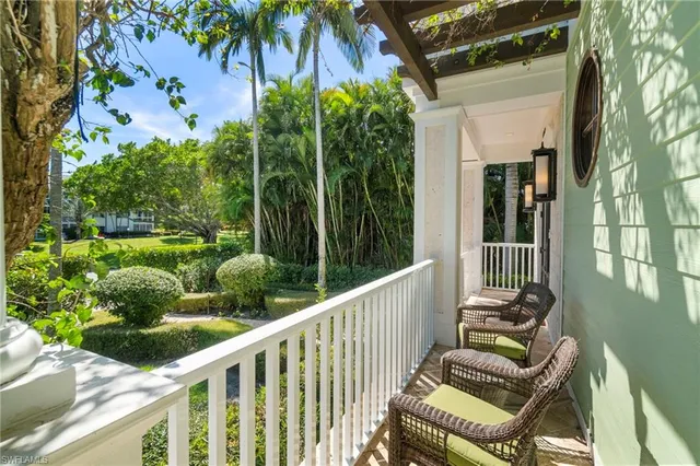 a view of a chair and tables front of the house