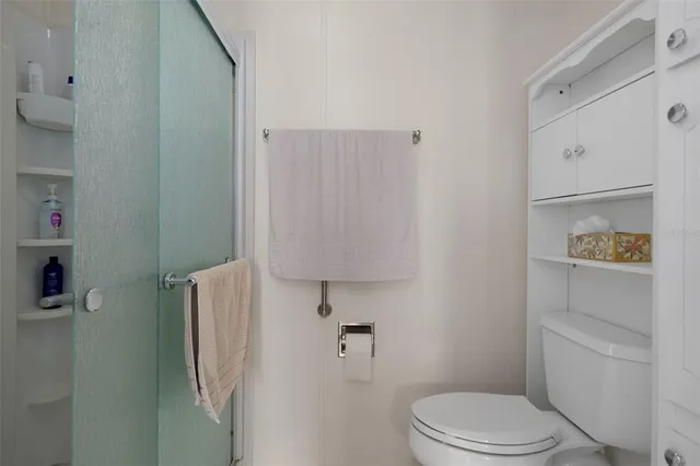 a bathroom with a sink toilet and mirror