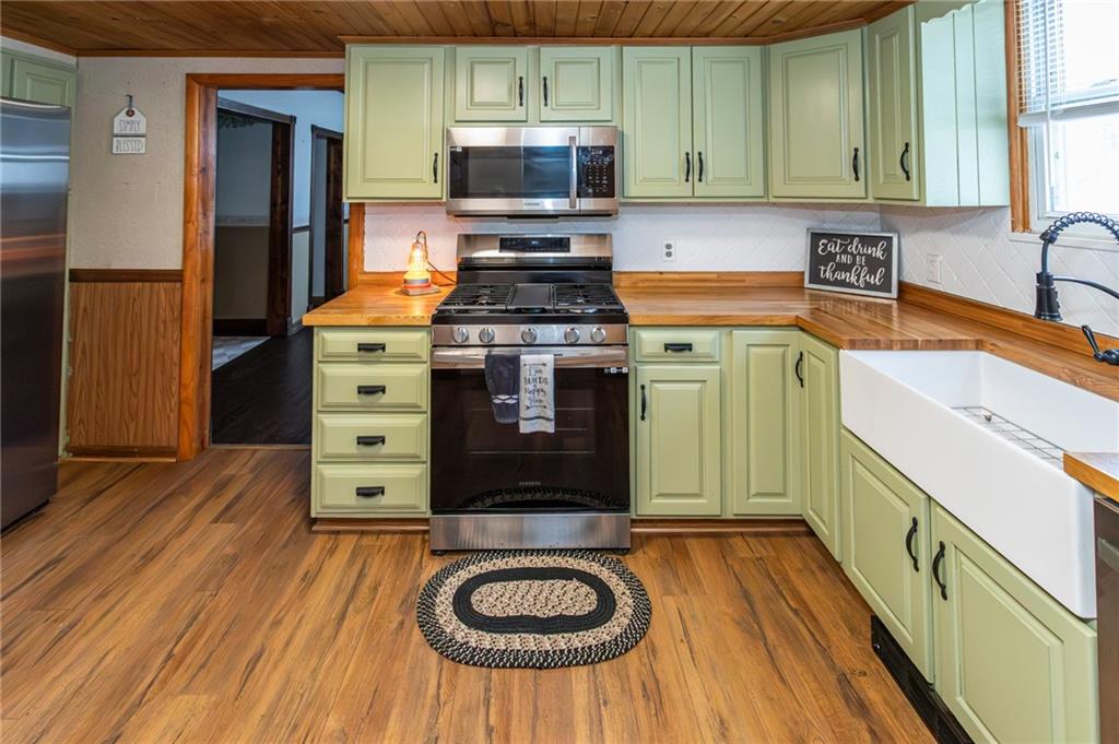 1001 Springfield Pike Connellsville, PA 15425 - Photo 15 of 35 a kitchen with stainless steel appliances granite countertop a stove a sink and a refrigerator