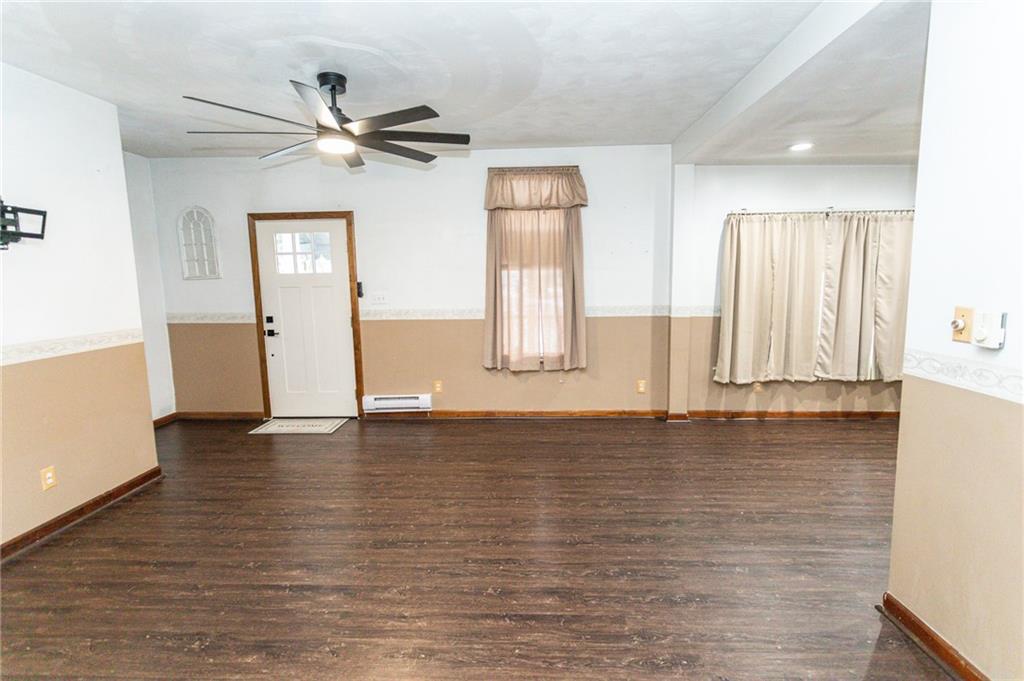 1001 Springfield Pike Connellsville, PA 15425 - Photo 23 of 35 a view of an empty room with window and wooden floor