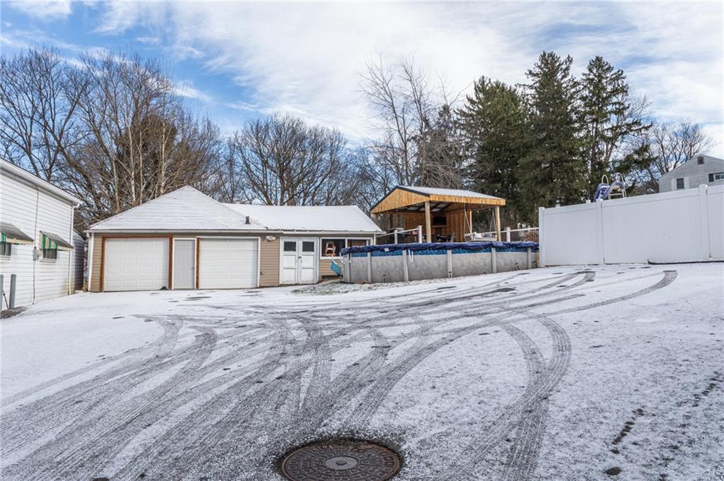 1001 Springfield Pike Connellsville, PA 15425 - Photo 5 of 35 a front view of a house with a yard and large trees