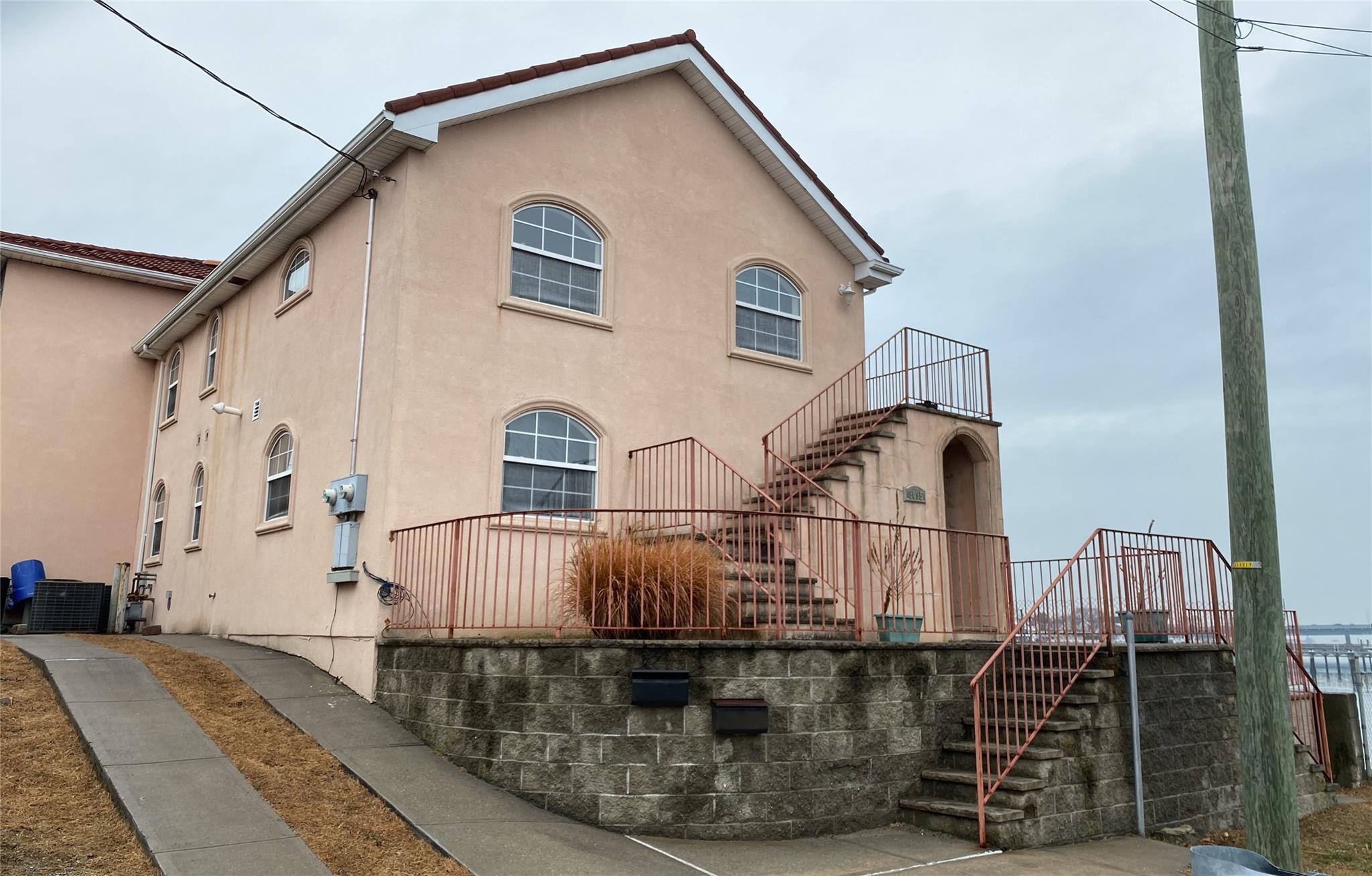 a view of a house with large windows