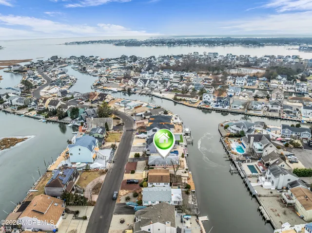 an aerial view of a city with ocean view