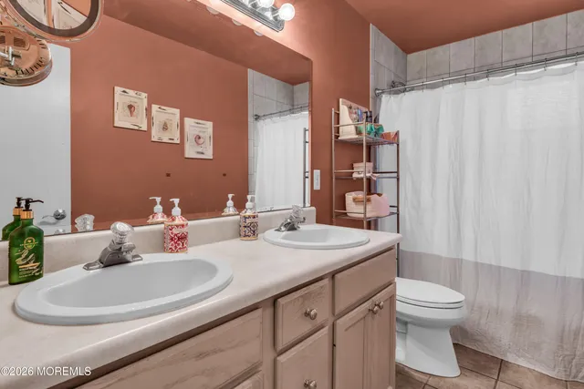 an aerial view of a house with a lake view