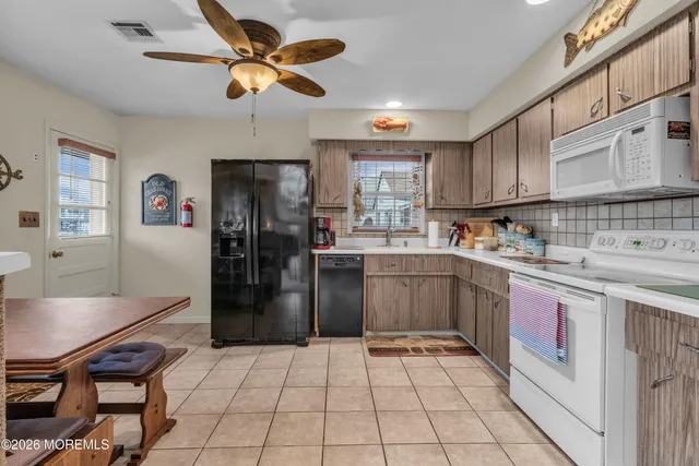 a house view with a backyard space